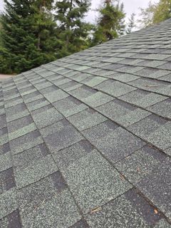 Damaged shingles before repair